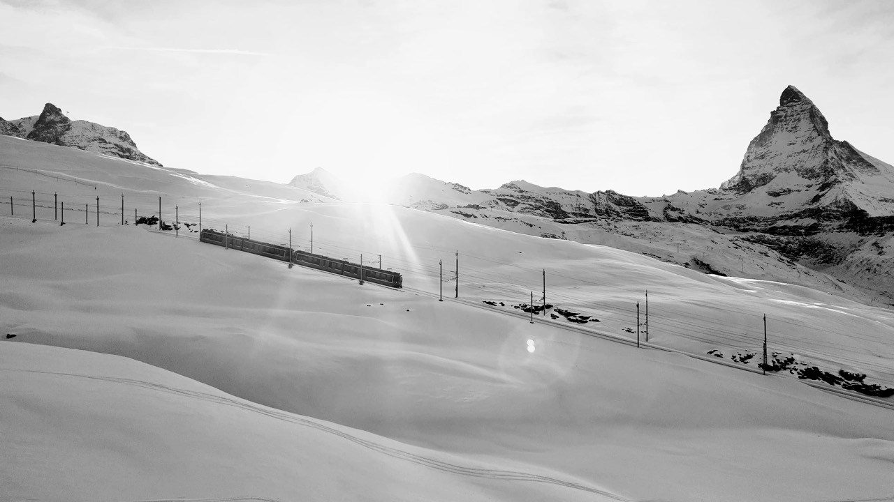 The Gornergrat railway crossing the snowfield toward the Matterhorn